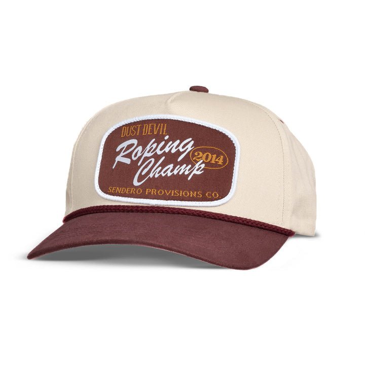 The Roping Champ Hat by Sendero Provisions Co. is a beige and maroon 5-panel trucker hat featuring a twill front patch that reads "Dust Devil Roping Champ 2014 Sendero Provisions Co.