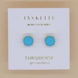 JaxKelly Round Turquoise Gemstone Earrings—hypoallergenic studs with gold-plated prongs, displayed on a white card reading "Wear Good Vibes" and "Turquoise grounding.