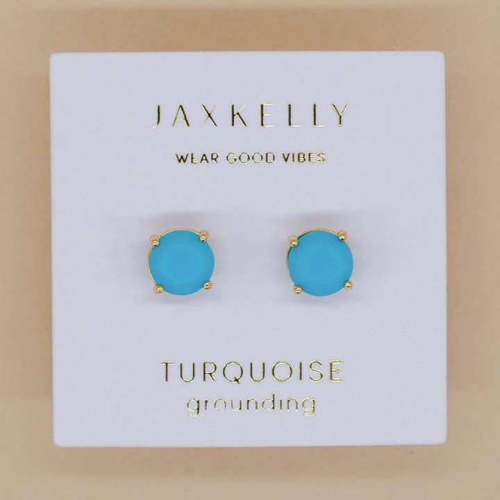 JaxKelly Round Turquoise Gemstone Earrings—hypoallergenic studs with gold-plated prongs, displayed on a white card reading "Wear Good Vibes" and "Turquoise grounding.