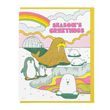 The "Season's Greetings" card by Lucky Horse Press features cartoon penguins, a walrus, seals, a polar bear, an igloo, rainbow, and text on a pastel arctic background. Letterpress printed in the USA.