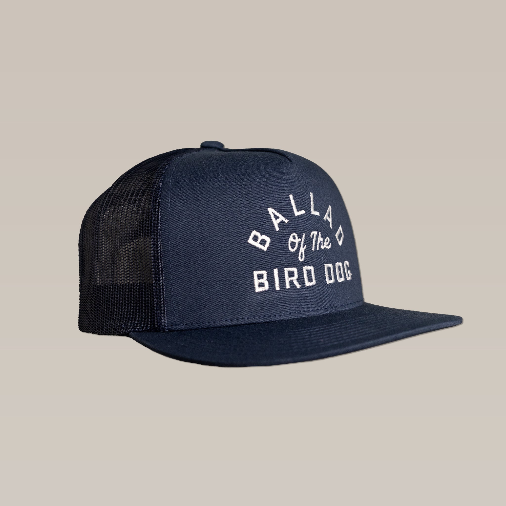 The Shop Hat | Arch Logo by Ballad of the Bird Dog is a stylish navy blue mesh hat with a crisp white "BALLAD OF THE BIRD DOG" arch logo embroidered on the front.