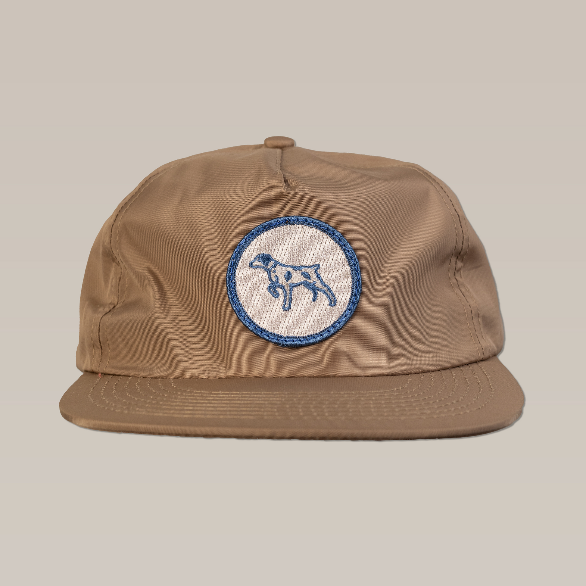 Shop Hat | Merit Badge | Ballad of the Bird Dog - Sand