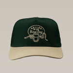 Dark green and beige Shop Hat by Ballad of the Bird Dog featuring an embroidered Rattlesnake Oval Logo and "Ballad of The Bird Dog Texas" on the front.