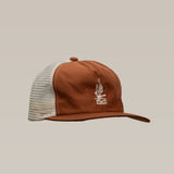 The "Shop Hat | Roadrunner Saguaro" by Ballad of the Bird Dog features brown and white mesh with a front embroidered logo, shown against a plain beige background.