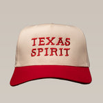 The Ballad of the Bird Dog Shop Hat is a beige and red baseball cap featuring "TEXAS SPIRIT" embroidered in red letters on the front.