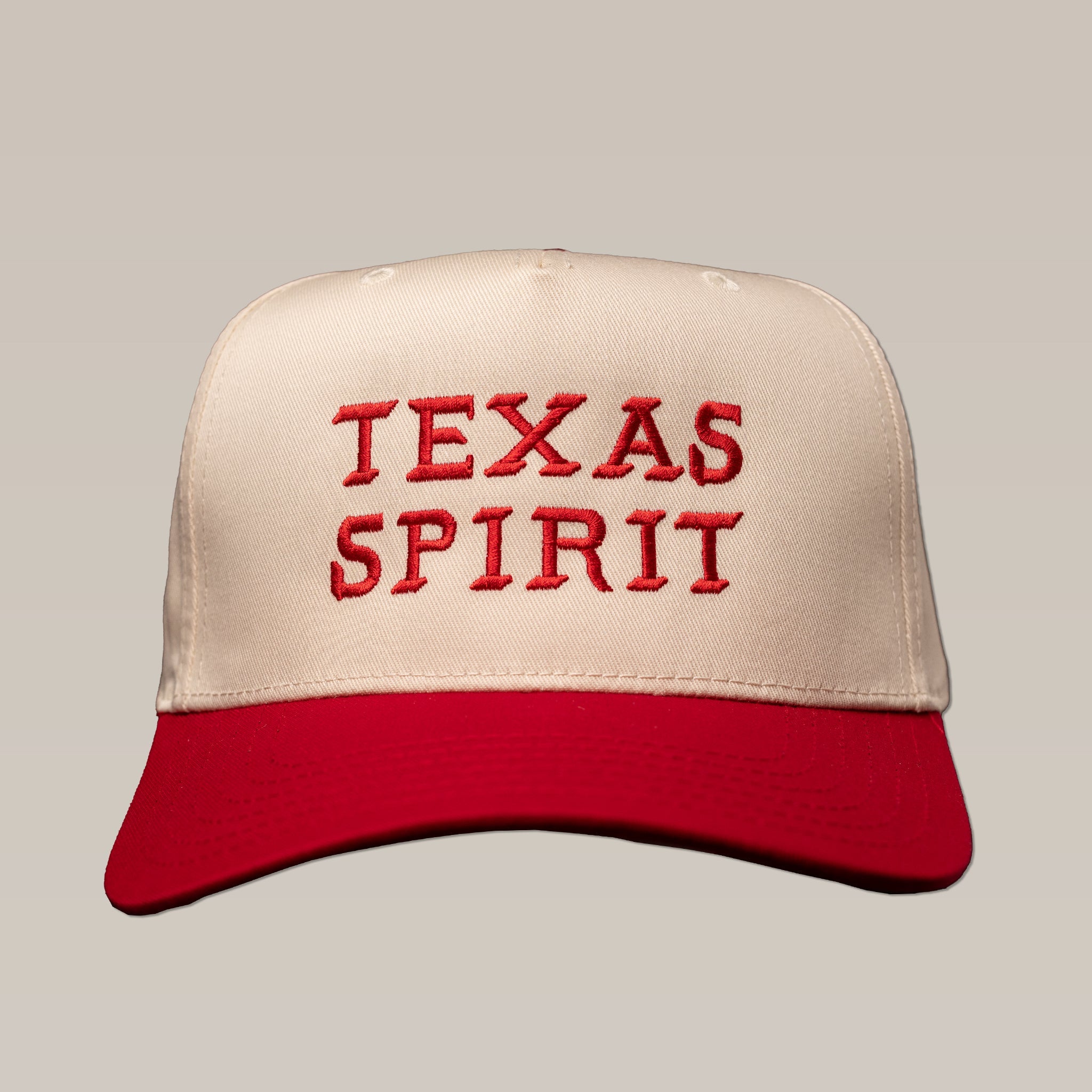 The Ballad of the Bird Dog Shop Hat features "TEXAS SPIRIT" embroidered in red on beige and red panels.
