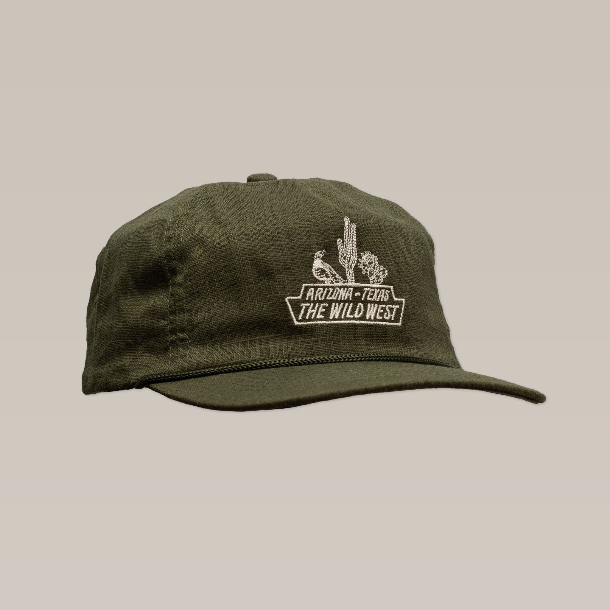 The Ballad of the Bird Dog Shop Hat | The Wild West features an olive green design with embroidered desert scene and "Arizona, Texas, The Wild West" text on the front, part of our desert series collection.