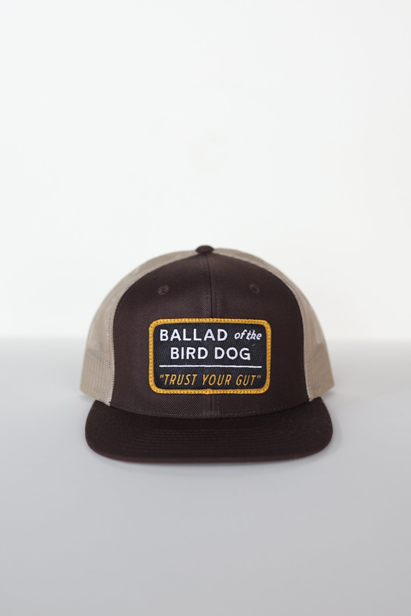 The Shop Hat | Trust Your Gut Vintage Slate by Ballad of the Bird Dog features a rectangular front patch reading "TRUST YOUR GUT," making it a standout addition to any hat collection.