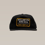 The Shop Hat | Trust Your Gut Vintage Slate by Ballad of the Bird Dog is a black snapback with a front patch reading "Trust Your Gut," combining modern comfort and classic style.