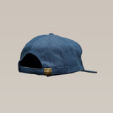 The Shop Hat | Trust Your Gut Vintage Slate by Ballad of the Bird Dog is a blue denim baseball cap shown from the back, featuring an adjustable strap with a small metallic clasp—ideal for vintage hat fans.