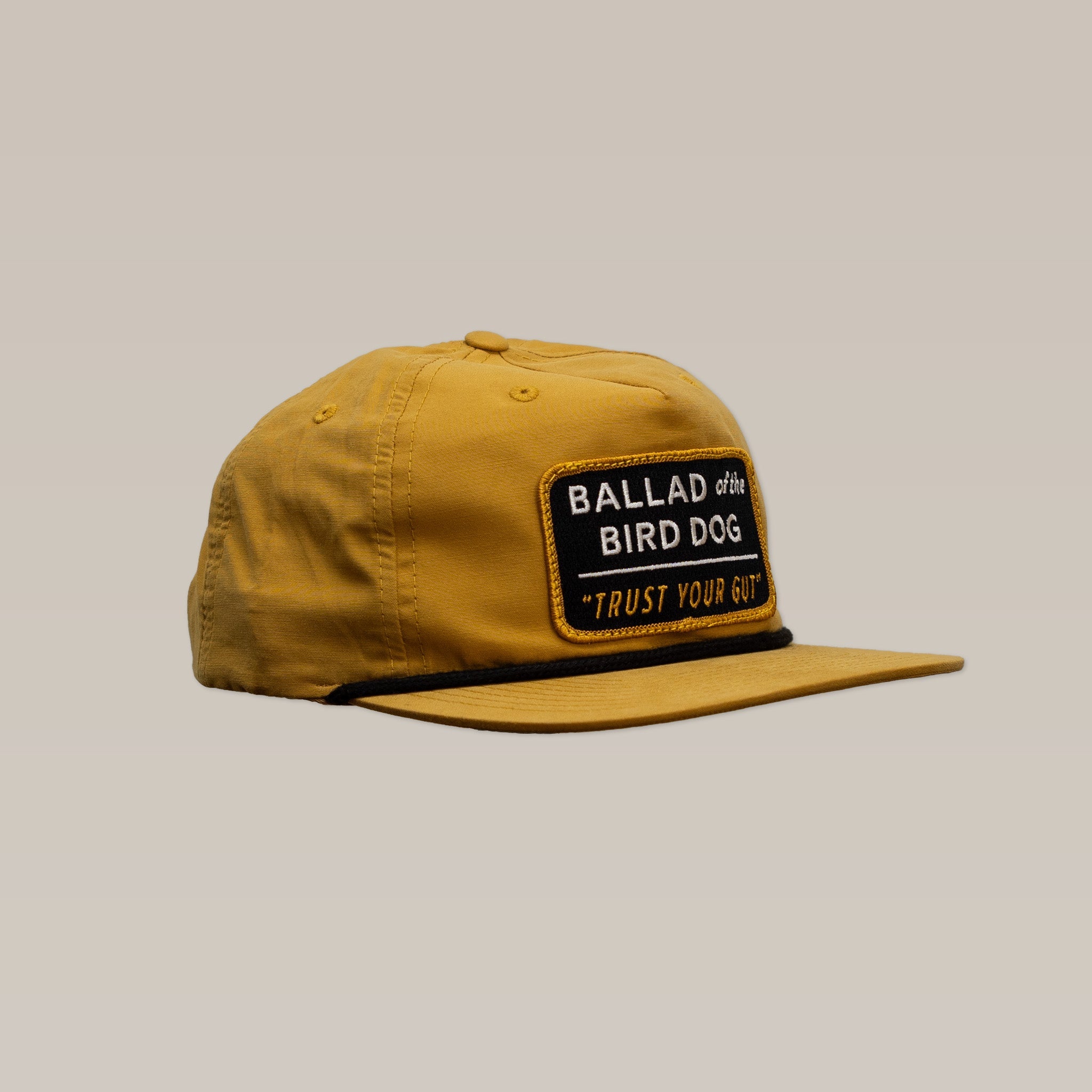 The Shop Hat | Trust Your Gut Vintage Slate by Ballad of the Bird Dog features a front patch reading “BALLAD of the BIRD DOG ‘TRUST YOUR GUT’”, making it the perfect casual accessory for true fans.