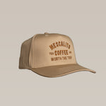 The Shop Hat | Worth The Trip by Mescalito Coffee features beige fabric and orange/brown “Mescalito Tex Coffee Co. Worth the Trip” embroidery—a relaxed hat, perfect for any adventure.