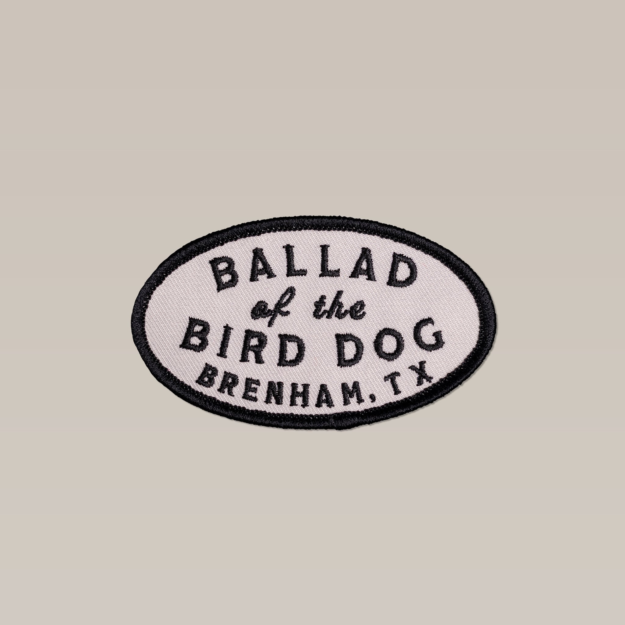 The Shop Patch | Classic Oval by Ballad of the Bird Dog features a handcrafted oval design with a black border and "Ballad of the Bird Dog, Brenham, TX" text—ideal for outdoor enthusiasts wanting local style.