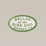 The Shop Patch | Classic Oval by Ballad of the Bird Dog features green edges and "Ballad of the Bird Dog Brenham, TX" in green on white—ideal for outdoor enthusiasts.