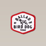 The Shop Patch | Field Companion by Ballad of the Bird Dog features a hexagonal design with a red border, black "Ballad of the Bird Dog Texas" text, and a dog outline—perfect for any patch collection.