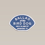 The Shop Patch | Home Base by Ballad of the Bird Dog features a blue background with white text: "Ballad of the Bird Dog, 100 E Alamo St, Brenham, TX," celebrating this local favorite.