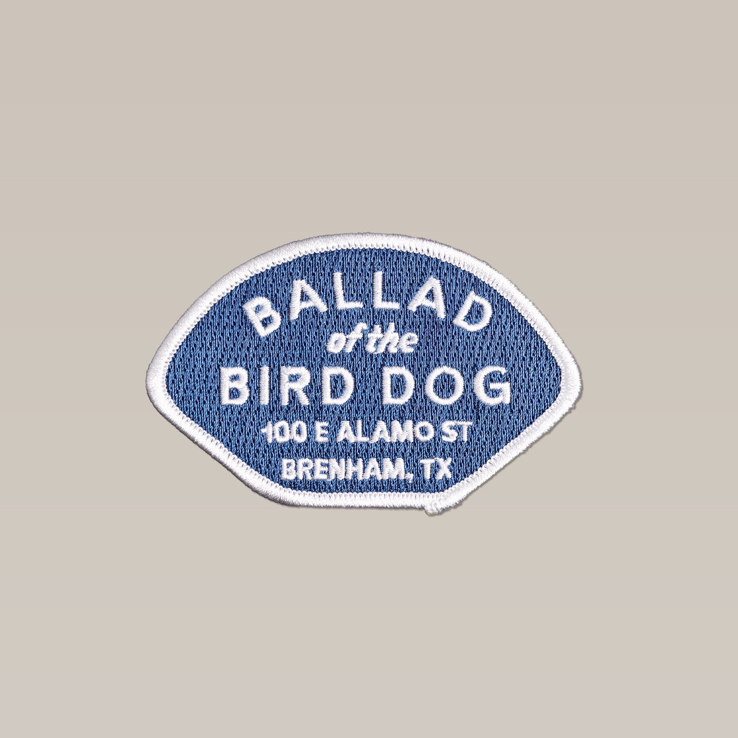 The Shop Patch | Home Base by Ballad of the Bird Dog features an embroidered blue and white design with "Ballad of the Bird Dog, 100 E Alamo St, Brenham, TX"—a perfect addition to your collection.