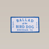 The Ballad of the Bird Dog Shop Patch is a rectangular cloth patch with shop logos, blue "Ballad of the Bird Dog, Brenham, TX, ESTD 2018" text on white, and a blue border.
