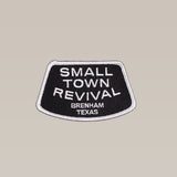 The Shop Patch by Ballad of the Bird Dog features "SMALL TOWN REVIVAL BRENHAM TEXAS" in black and white embroidery, perfect for anyone who supports or celebrates small towns.