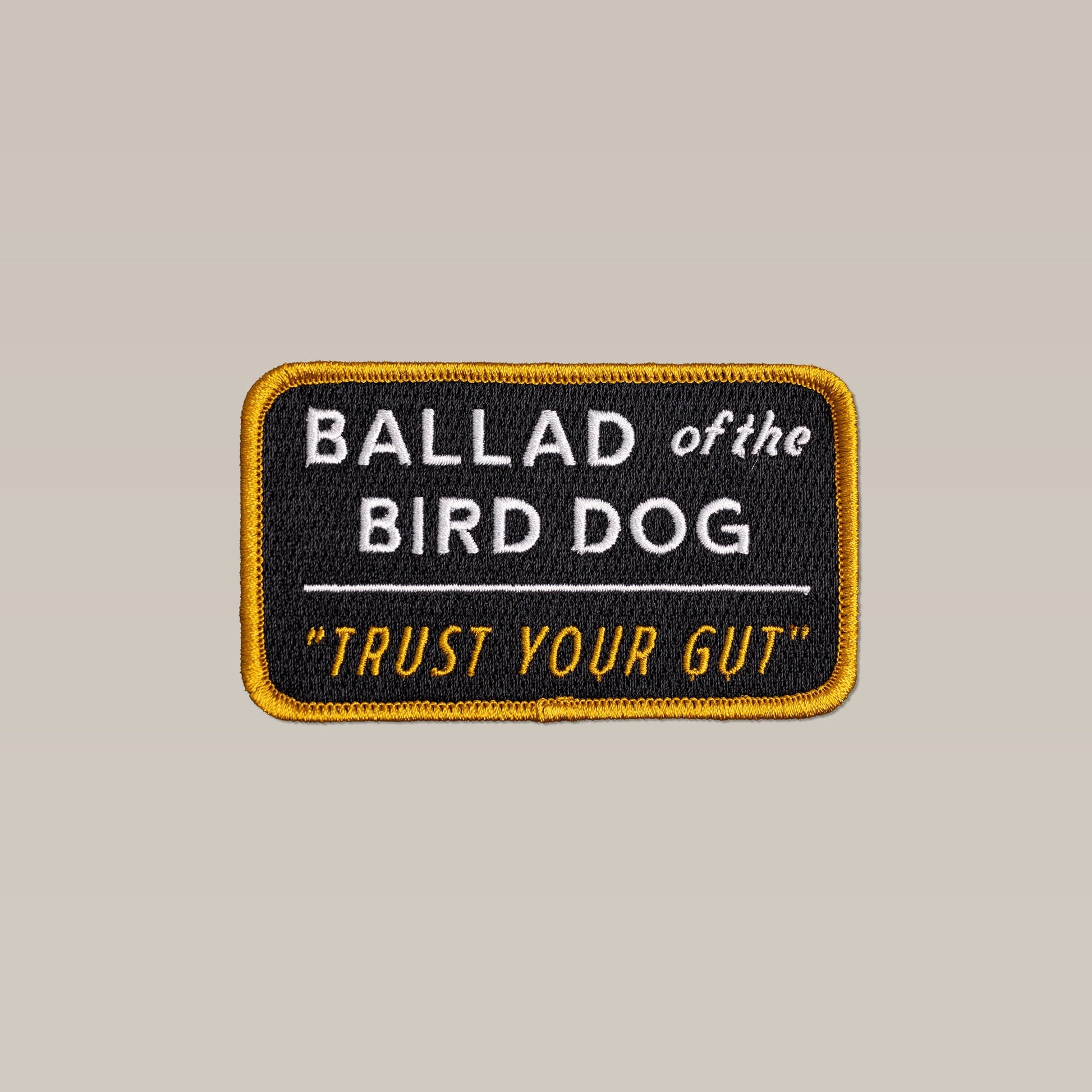 The Ballad of the Bird Dog Shop Patch features "Trust Your Gut" text on a vintage slate background with a yellow border.