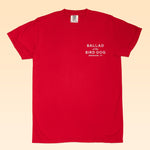 The Bird Dog Classic Shop Logo Tee by Ballad of the Bird Dog features "BALLAD of the BIRD DOG BRENHAM, TX" printed in white on soft organic cotton for a comfy, handcrafted feel.