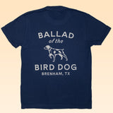 The Shop Shirt | Bird Dog Classic Shop Logo from Ballad of the Bird Dog features white text on blue organic cotton, combining comfort with style.