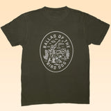 Ballad of the Bird Dog’s Shop Shirt | Desert Covey Flush is an olive green tee featuring a hand-printed white graphic on the back with a desert scene and "Ballad of the Bird Dog"—ideal outdoor apparel for adventure lovers.