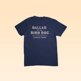The Shop Shirt from Ballad of the Bird Dog is a navy tee with "BALLAD OF THE BIRD DOG, 100 S ALAMO ST, BRENHAM, TX, GENERAL GOODS" in white—a tribute to the beloved general goods store in Downtown Brenham.