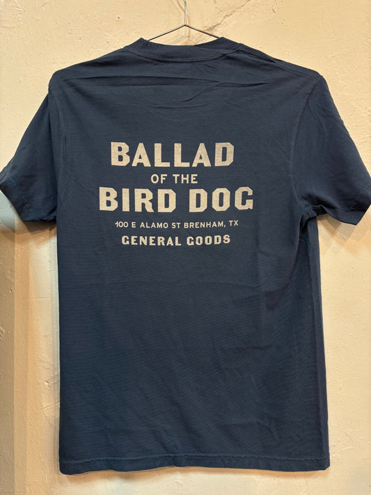 The Shop Shirt | General Goods by Ballad of the Bird Dog is a navy tee featuring bold white back text: “BALLAD OF THE BIRD DOG, 100 E ALAMO ST BRENHAM, TX, GENERAL GOODS”—a stylish tribute to their beloved Downtown Brenham store.