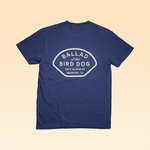 The Shop Shirt | Home Base by Ballad of the Bird Dog is a navy Comfort Colors tee with a bold white back graphic: "BALLAD of the BIRD DOG, 100 E ALAMO ST, BRENHAM, TX.