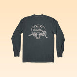 Long-sleeve Shop Shirt by Ballad of the Bird Dog featuring a dark design with a rattlesnake oval graphic and "Ballad of the Bird Dog Texas" text on the back.