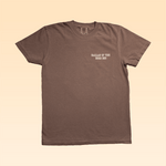 The Shop Shirt | Old Fashioned by Ballad of the Bird Dog is a brown tee inspired by classic western styles, featuring "BALLAD OF THE BIRD DOG" in white on the left chest.