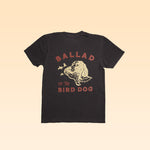 The Ballad of the Bird Dog Shop Shirt | Retriever features a black t-shirt with a dog’s head, two birds, and bold “BALLAD OF THE BIRD DOG” text on the back.