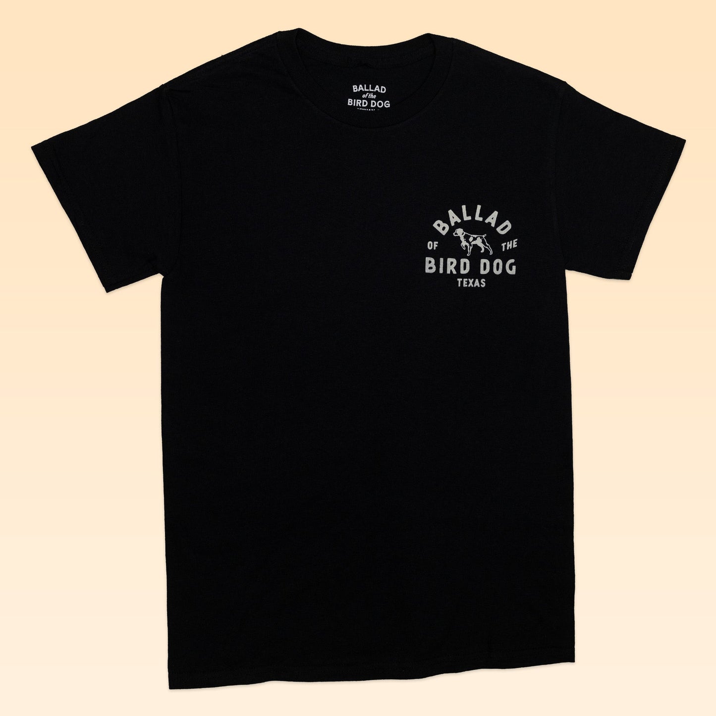 The Shop Shirt | Scorpion by Ballad of the Bird Dog is a black tee from the Desert Scenes Collection, featuring a small white “Ballad of the Bird Dog Texas” chest graphic and unique hand-printed design.