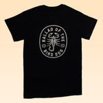 The Shop Shirt | Scorpion by Ballad of the Bird Dog features a white oval scorpion design and text on the back—a unique hand-printed tee from our Desert Scenes Collection.