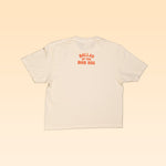 The Shop Shirt | Somewhere Texas Crop by Ballad of the Bird Dog is a cream short sleeve tee featuring "BALLAD OF THE BIRD DOG" in orange on the upper back—perfect for capturing the charm of small town Texas.