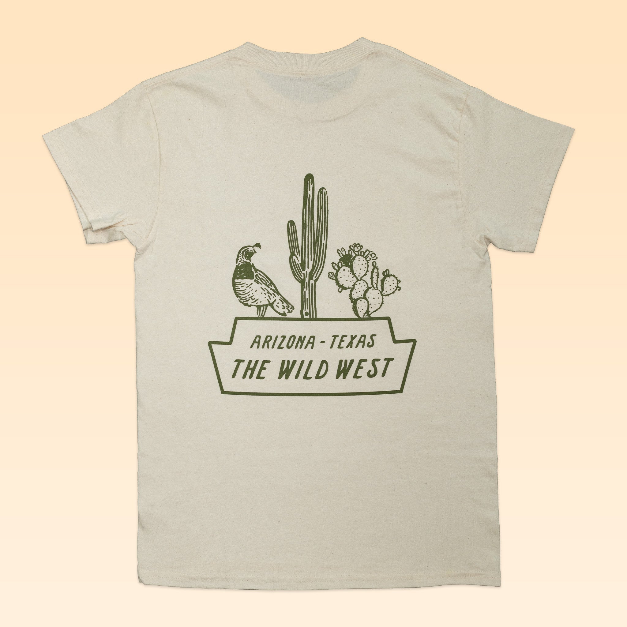 Back of a beige Shop Shirt by Ballad of the Bird Dog featuring green cactus and bird illustrations, plus "Arizona - Texas The Wild West" text.