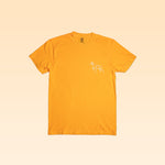 The Shop Shirt | Upland by Ballad of the Bird Dog is a plain yellow tee with a small white outline graphic of a dog on the left chest, shown on a light yellow background.