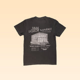 The 1844 Liquor Market Shop Shirt features a white line drawing of a two-story building and "1844 Liquor Market" text on the front, with "Winner Winner Chicken Dinner" printed on the back—a vintage-style black tee from 1844 Liquor Market.