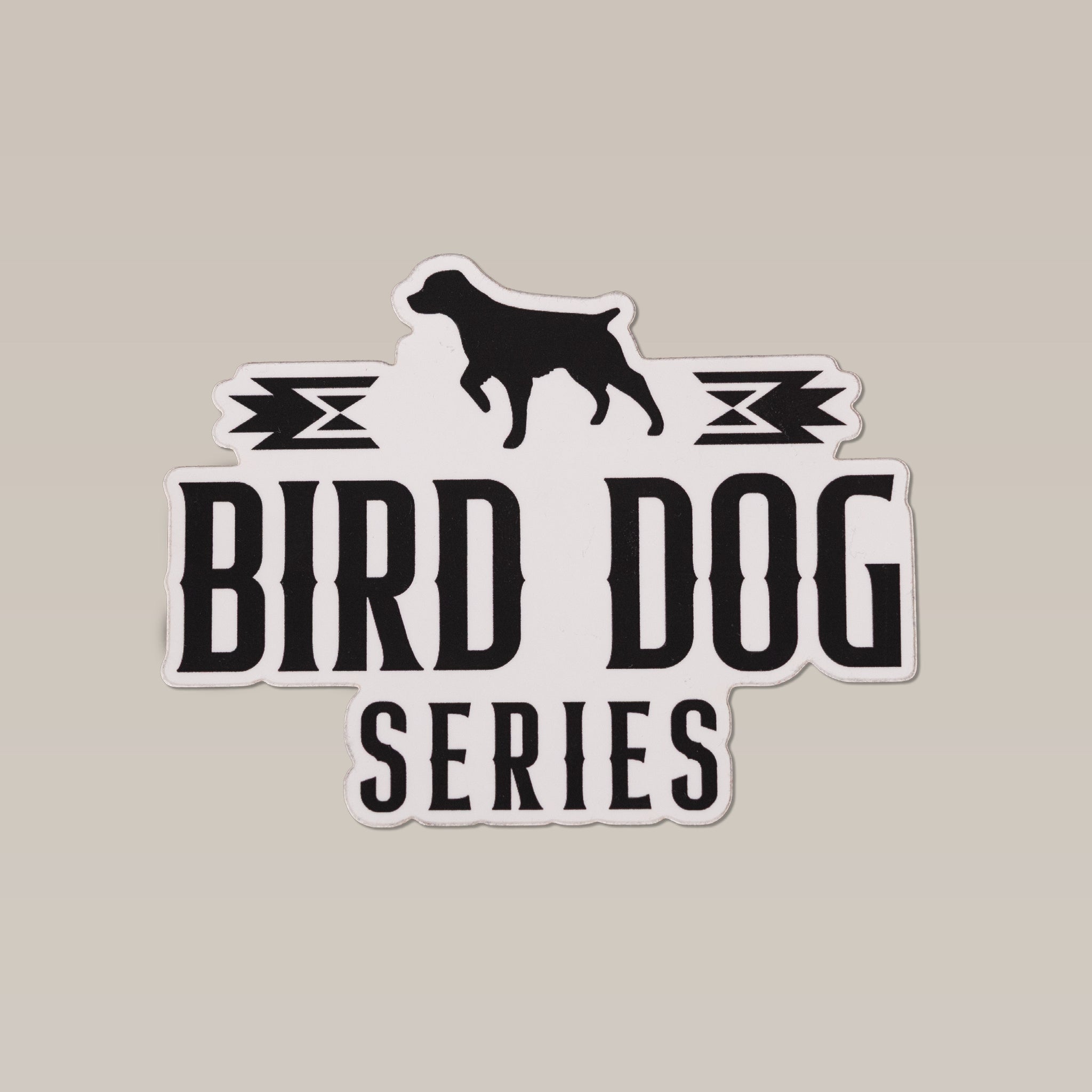 The Ballad of the Bird Dog "Bird Dog Series" shop sticker features a black dog silhouette above the series name with stylish accents on a light background, capturing adventure and tradition.