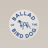 The Shop Sticker | Circle Clubhouse Tradition by Ballad of the Bird Dog features a white circle with blue "Ballad of the Bird Dog" text and a dog illustration—an ideal Texas sticker for collectors and fans.