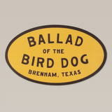 The Ballad of the Bird Dog Shop Sticker | Classic Oval features bold black text on a yellow background and is perfect as a 5-inch cooler sticker or for your collection.