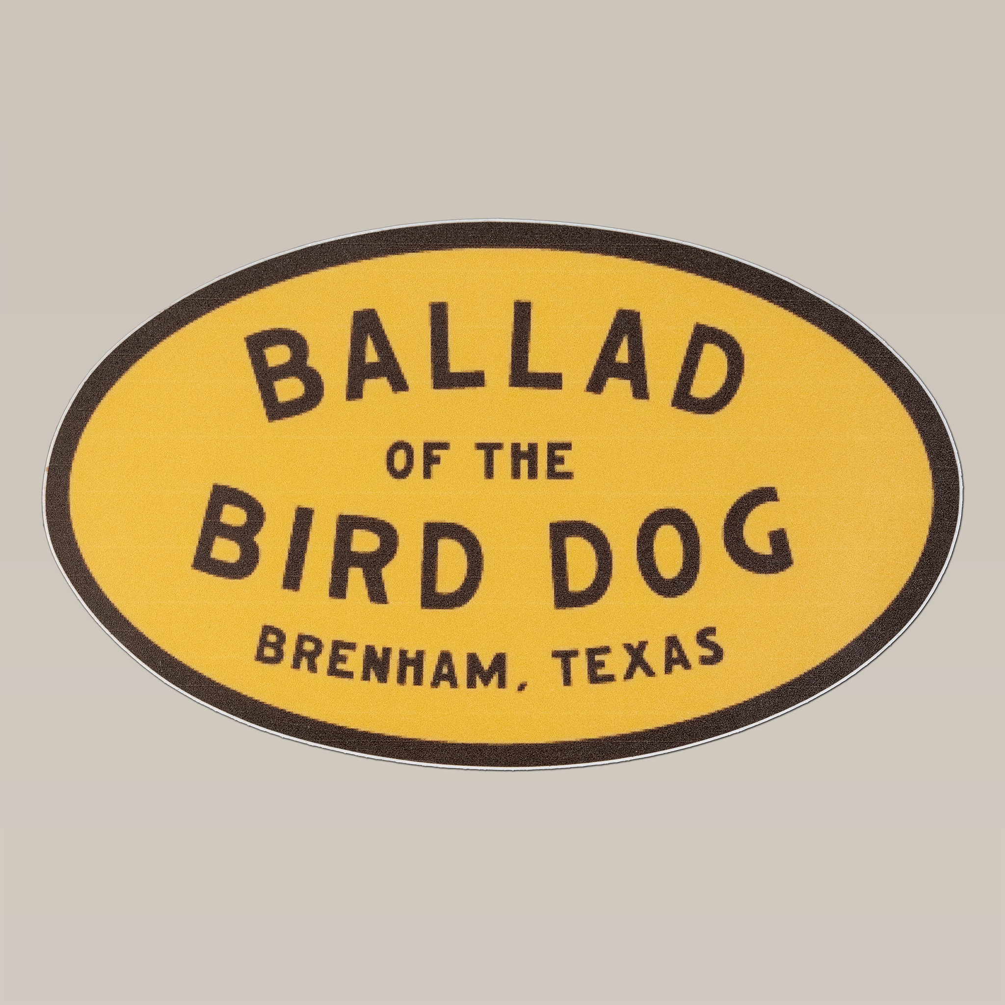 The Ballad of the Bird Dog Shop Sticker | Classic Oval features bold black text on a yellow background and is perfect as a 5-inch cooler sticker or for your collection.