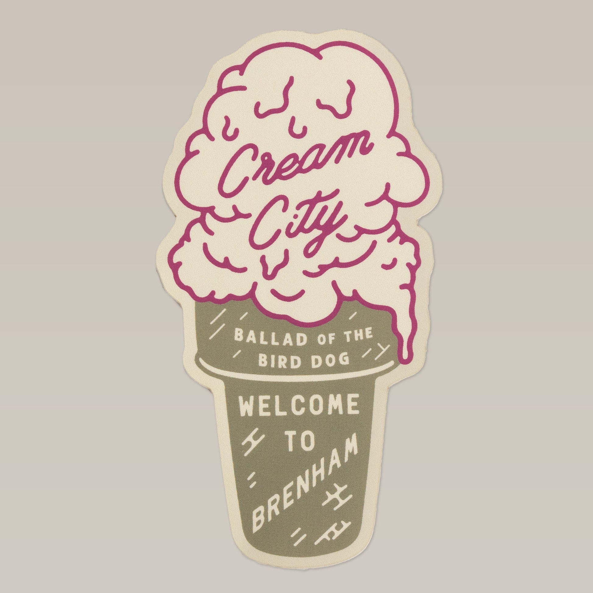 Shop Sticker | Cream City by Ballad of the Bird Dog features an ice cream cone design with "Cream City," "Ballad of the Bird Dog," and "Welcome to Brenham" on a beige background—a playful tribute to Brenham, home of Blue Bell Creameries.