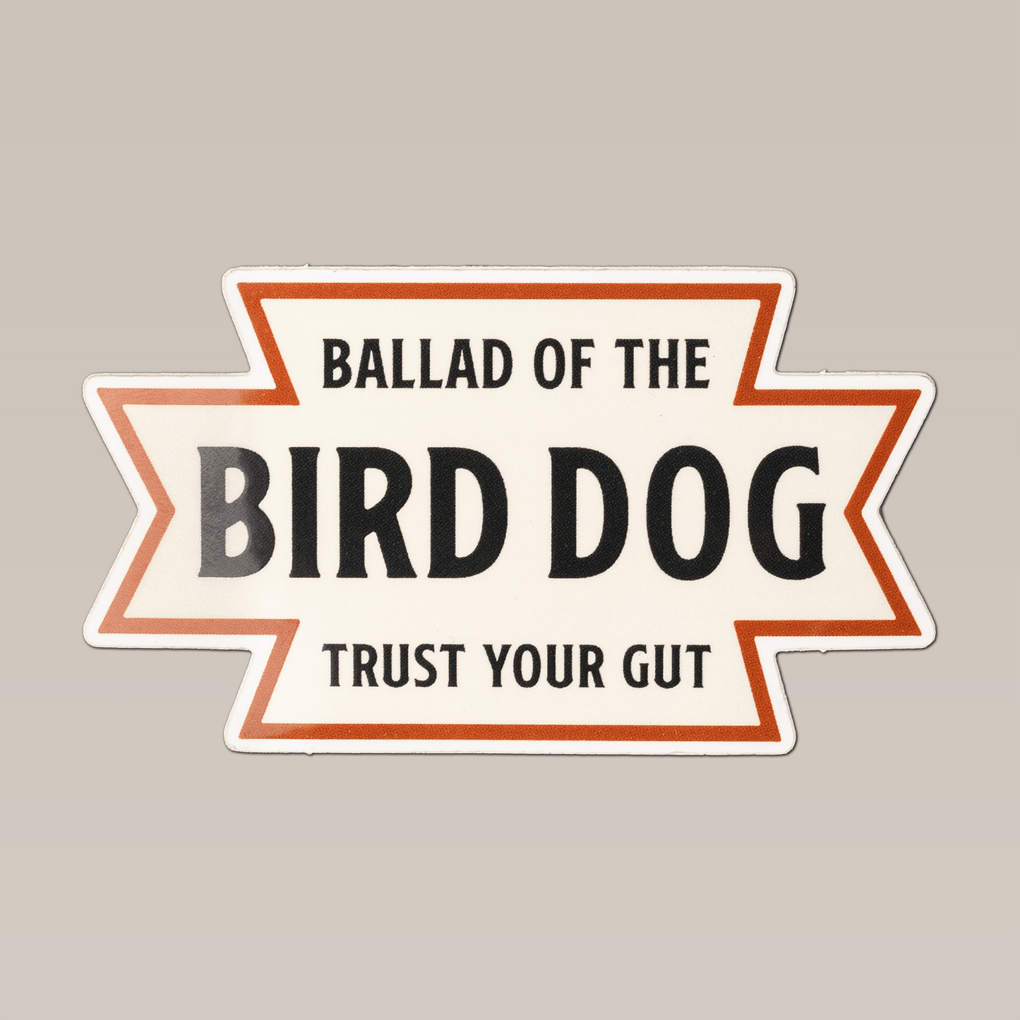 The Shop Sticker | Desert Dog by Ballad of the Bird Dog features a white background, orange border, and bold “TRUST YOUR GUT” text—perfect for Southwestern vibes inspired by the American desert.