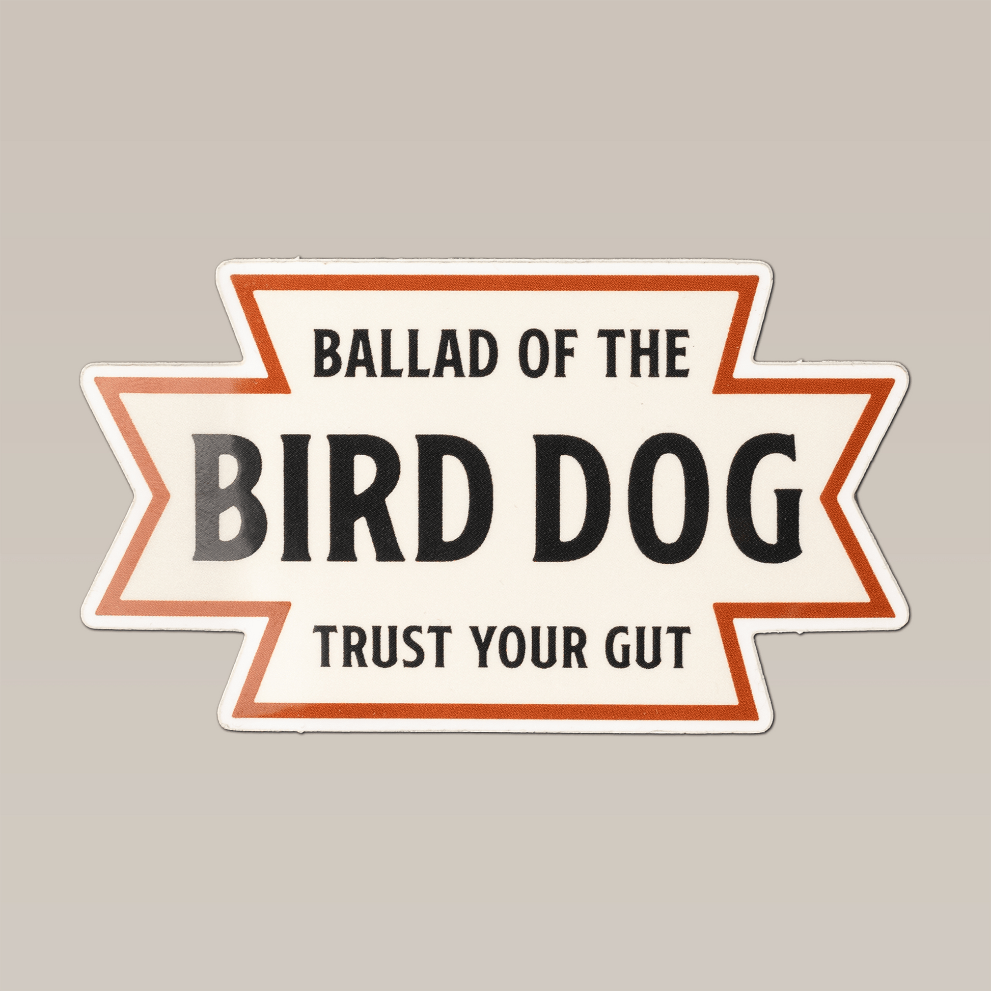 The Shop Sticker | Desert Dog by Ballad of the Bird Dog features a white background, orange border, and bold “TRUST YOUR GUT” text—perfect for Southwestern vibes inspired by the American desert.
