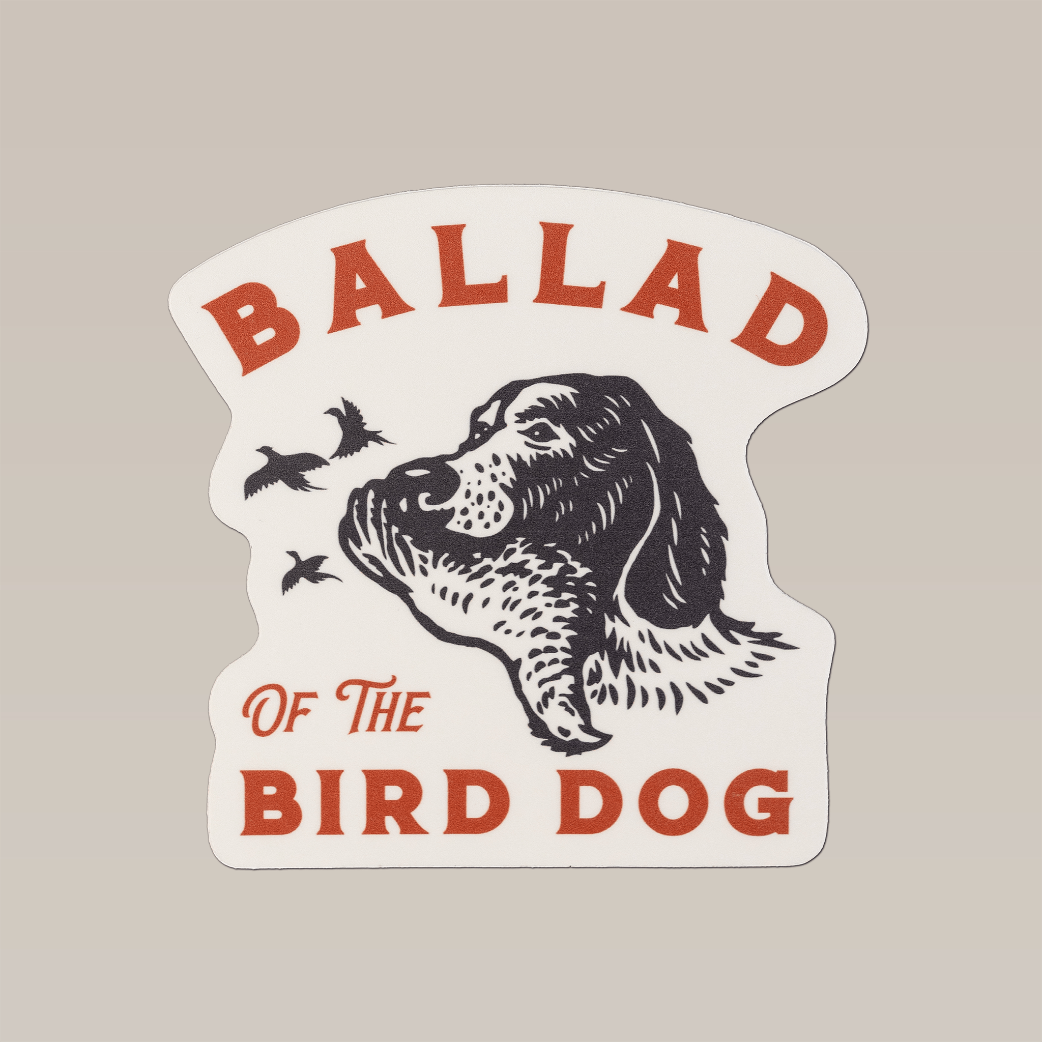 The Ballad of the Bird Dog Shop Sticker | Retriever features a black and white dog’s head with two birds and bold red text on a cream background—ideal for fans of unique hunting or bird dog stickers.