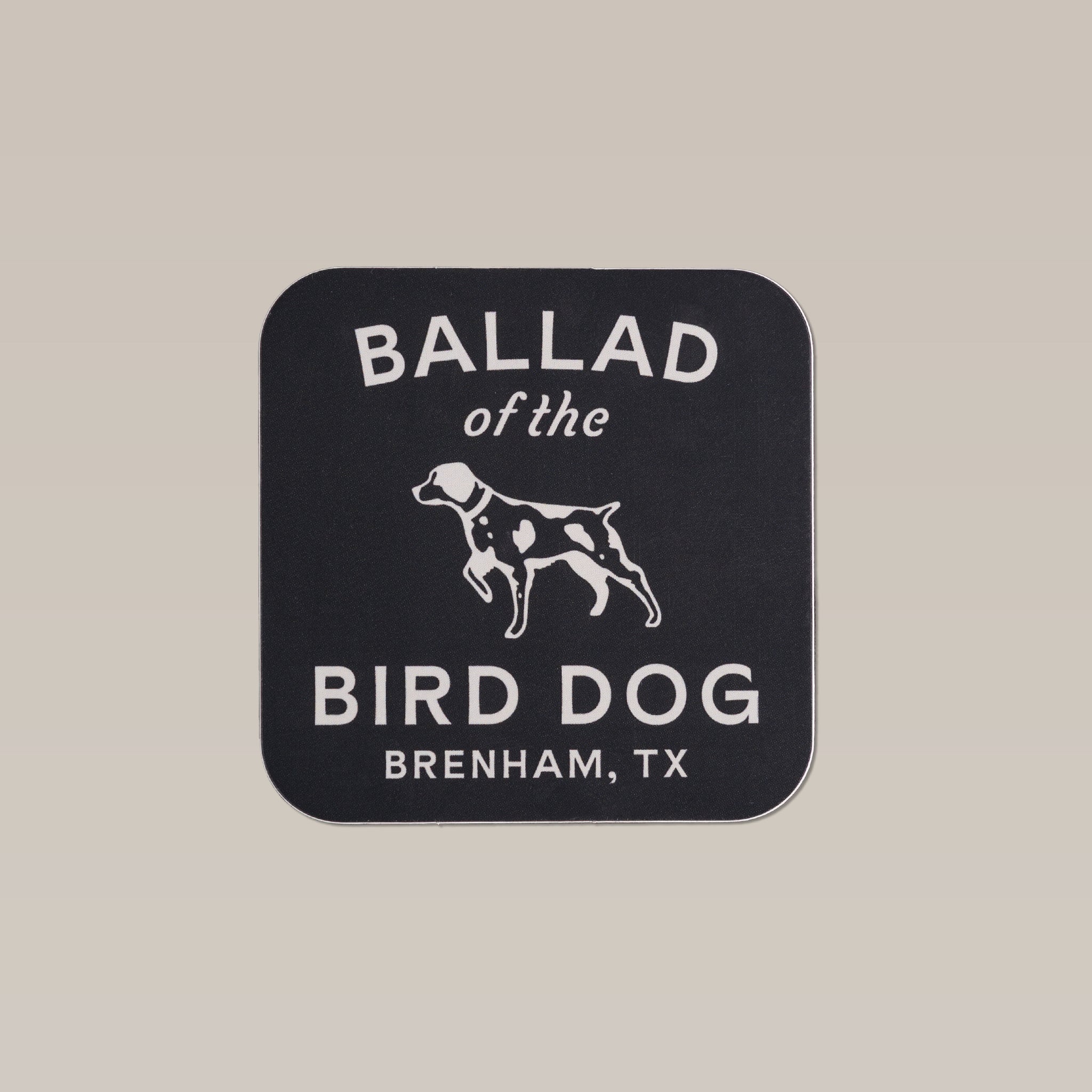 Shop sticker featuring Ballad of the Bird Dog's full lockup logo in white text with a standing dog illustration and "Brenham, TX" on a black background.