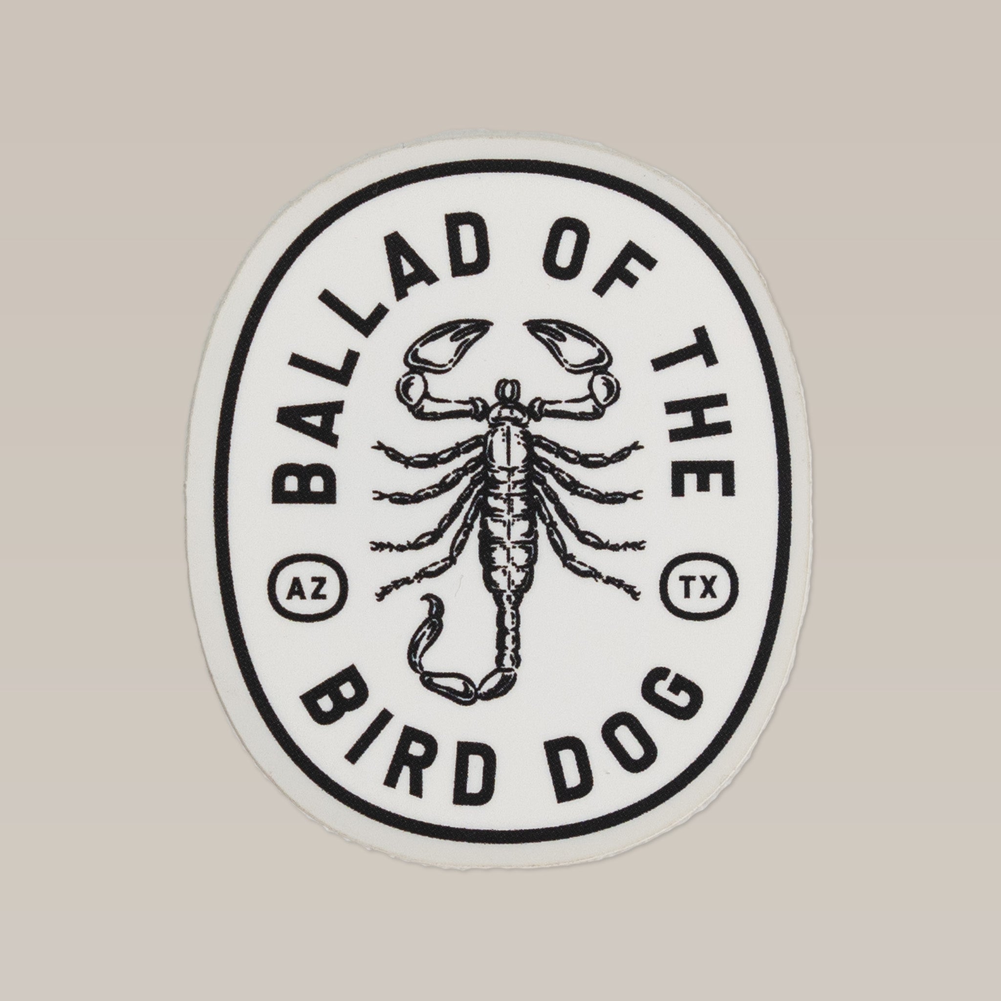 The Shop Sticker | Scorpion by Ballad of the Bird Dog features a black Scorpion logo on a white patch with "AZ" and "TX" in circles. Part of the Desert Series, it's a true shop favorite.