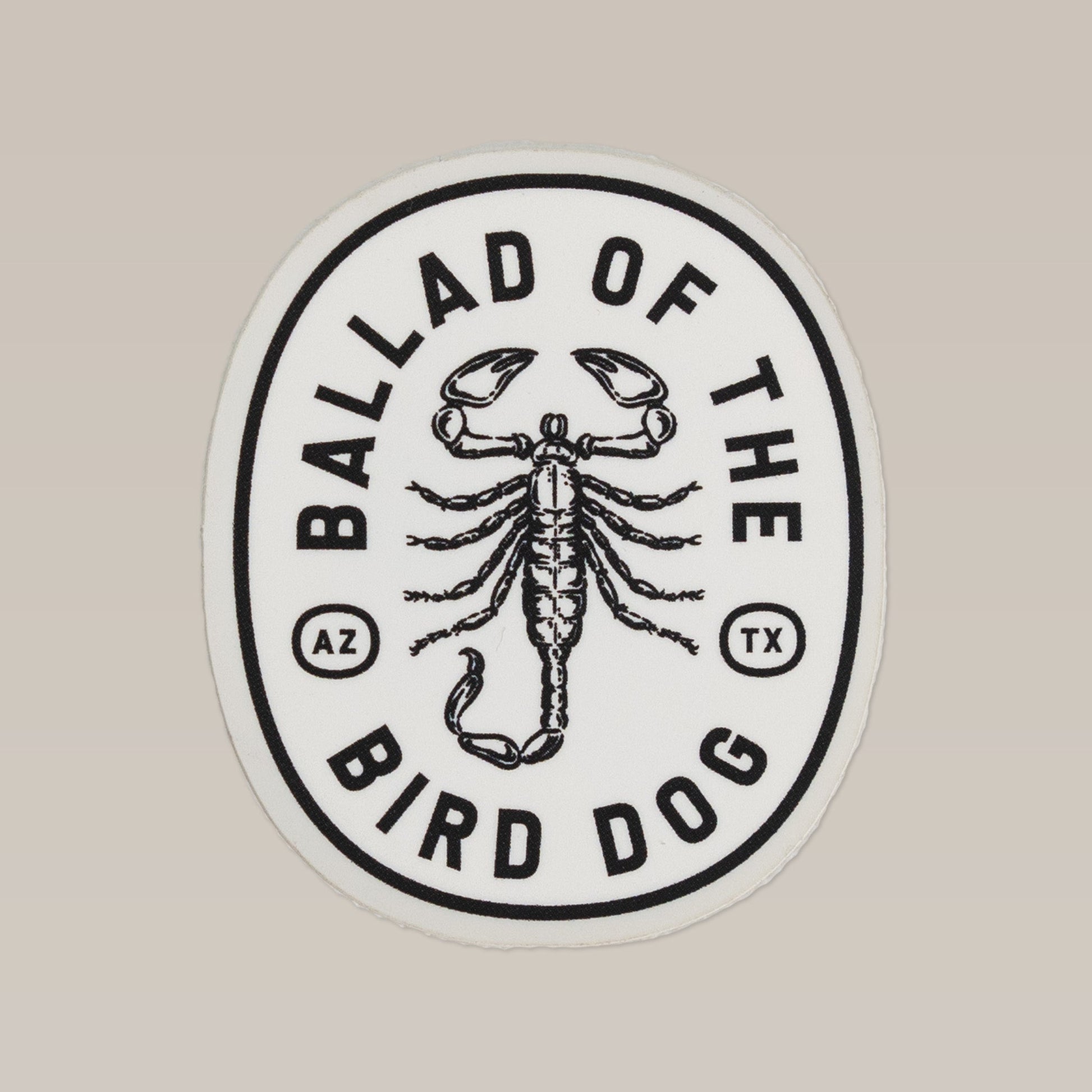 The Shop Sticker | Scorpion by Ballad of the Bird Dog features a bold black and white logo with "Ballad of the Bird Dog," "AZ," and "TX"—a shop favorite from the Desert Series.